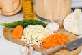 Shredded cabbage and carrots and a wooden barrel for pickling on the table Royalty Free Stock Photo