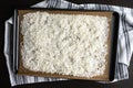 Shredded Coconut on a Parchment Lined Sheet Pan Royalty Free Stock Photo