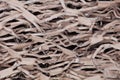 Shredded and crimped brown cardboard background texture Royalty Free Stock Photo