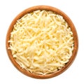 Shredded mozzarella cheese, low-moisture mozzarella, in wooden bowl Royalty Free Stock Photo