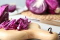 Shredded red cabbage and cutting board on table, closeup Royalty Free Stock Photo