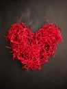 Shredded red paper shaped as a heart shape Royalty Free Stock Photo