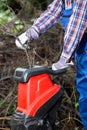 Shredding branches with an electric garden shredder Royalty Free Stock Photo