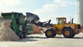 shredding wood in a sawmill - further processing into wood pellets Royalty Free Stock Photo