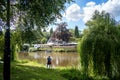 Lady taking a photo by the River Severn in Shrewsbury, Shropshire, England, on July 13, Royalty Free Stock Photo