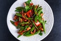 Shrimp and Asparagus stir fry food on white plate