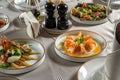 Shrimp and avocado salad, bacon lard and other dishes. Fine dining restaurant, perfect display. Royalty Free Stock Photo