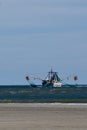 A Shrimp Boat with Nets Out Royalty Free Stock Photo