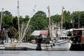 Shrimp boats docked at a wooden pier Royalty Free Stock Photo