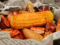 Shrimp boil with sausage corn potatoes on dinner table