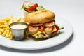 Shrimp burger with caviar, vegetable salad and french fries, shrimp sauce Royalty Free Stock Photo