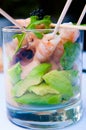 Shrimp cocktail in a glass with letouce