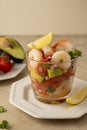 Shrimp cocktail with tomatoe, avocado, red onion and lemon. Shrimp salad served in glass cup. Royalty Free Stock Photo