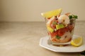 Shrimp cocktail with tomatoe, avocado, red onion and lemon. Shrimp salad served in glass cup, copy space Royalty Free Stock Photo