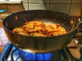 Shrimp cooked in a frying pan on a gas stove Royalty Free Stock Photo