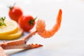 Shrimp on crab claws tomato lemon decorate on dining table background