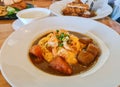 Shrimp in curry sauce with rice and coriander closeup on plate Royalty Free Stock Photo