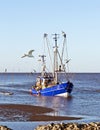 Shrimp cutter on the North Sea in Dorum near Cuxhaven Royalty Free Stock Photo