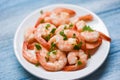 Shrimp delicious seasoning spices on white plate and wooden table background cooked shrimps or prawns , Seafood shelfish