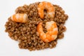 Shrimp fried in oil laid out on white plate buckwheat