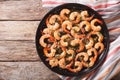 Shrimp in garlic sauce with parmesan cheese and herbs in a pan c Royalty Free Stock Photo