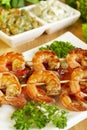 Shrimp-grill on wooden sticks Royalty Free Stock Photo