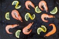 shrimp, lemon and sea salt on a dark black background Royalty Free Stock Photo