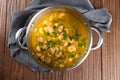 Shrimp moqueca in aluminum pan top view. Brazilian traditional food