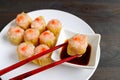 Shrimp and Pork Filled Chinese Steamed Dumpling Being Dipped in Soy-vinegar Sauce Royalty Free Stock Photo