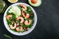 Shrimp salad with fresh green arugula leaves and avocado, radicchio, almond and sesame seeds Royalty Free Stock Photo