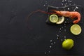 Shrimp with salt and lemon on black background Royalty Free Stock Photo