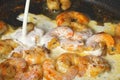 Shrimp and Sauce Cooking in Pan on Stove