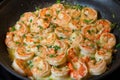 Shrimp scampi cooking in a fry pan