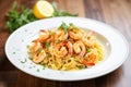 shrimp scampi over pasta with parsley garnish Royalty Free Stock Photo