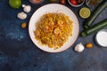 Shrimp Stir Fry with pasta and ingredients, zucchini, lime, cherry tomatoes, garlic and seasonings. With space Royalty Free Stock Photo