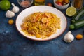 Shrimp Stir Fry with pasta and ingredients, zucchini, lime, cherry tomatoes, garlic and seasonings. With space Royalty Free Stock Photo
