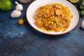 Shrimp Stir Fry with pasta and ingredients, zucchini, lime, cherry tomatoes, garlic and seasonings. With space Royalty Free Stock Photo