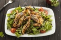 Shrimp vegetable salad in batter on a dark wooden table, oriental and asian cuisine