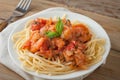 Shrimp in wine tomato sauce over spaghetti pasta