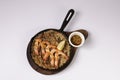 SHRIMPS AND ANDOUILLE JAMBALAYA in dish top view on grey background singapore food