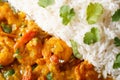 Shrimps curry with rice and cilantro macro. horizontal top view Royalty Free Stock Photo