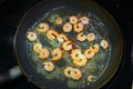 Shrimps are fried in a frying pan 1 Royalty Free Stock Photo