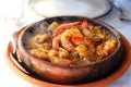 Shrimps on frying pan with lemon. Royalty Free Stock Photo