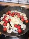 Shrimps pan fried with cocktail tomatoes Royalty Free Stock Photo