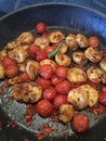 Shrimps pan fried with cocktail tomatoes Royalty Free Stock Photo