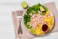 shrimps with lettuce, corn chips, chili sauce