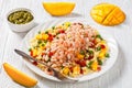 Shrimps and millet pilaf with mango and veggies