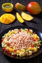 Shrimps and millet pilaf with mango and veggies