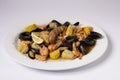 SHRIMPS AND MUSSELS CLAWDADDY BOIL in dish top view on grey background singapore food