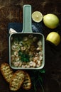 Shrimps  in olive oil with garlic and parsley, spanish style tapas with toast on rustic wooden background Royalty Free Stock Photo